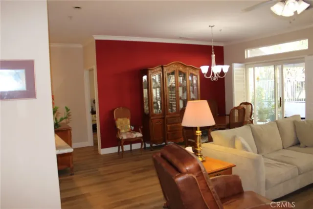 a living room with furniture and a lamp