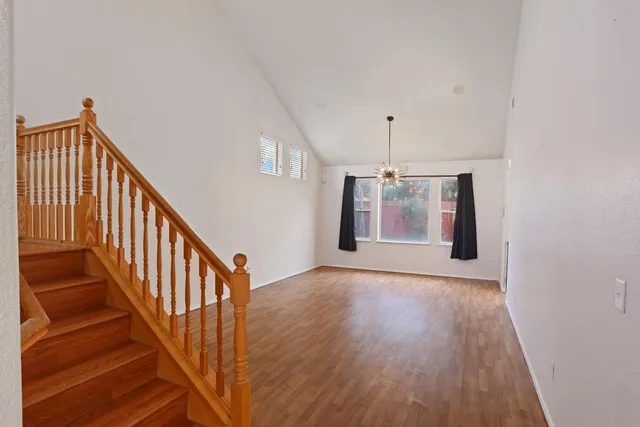 a view of an entryway with wooden floor