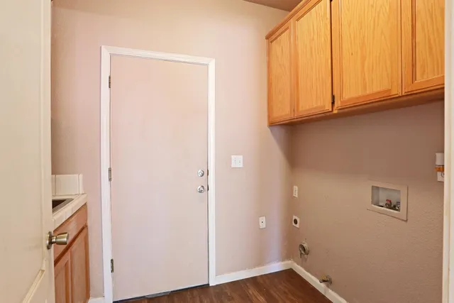 a view of cabinets and wooden floor