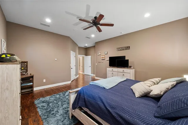 a bedroom with a bed and a couch