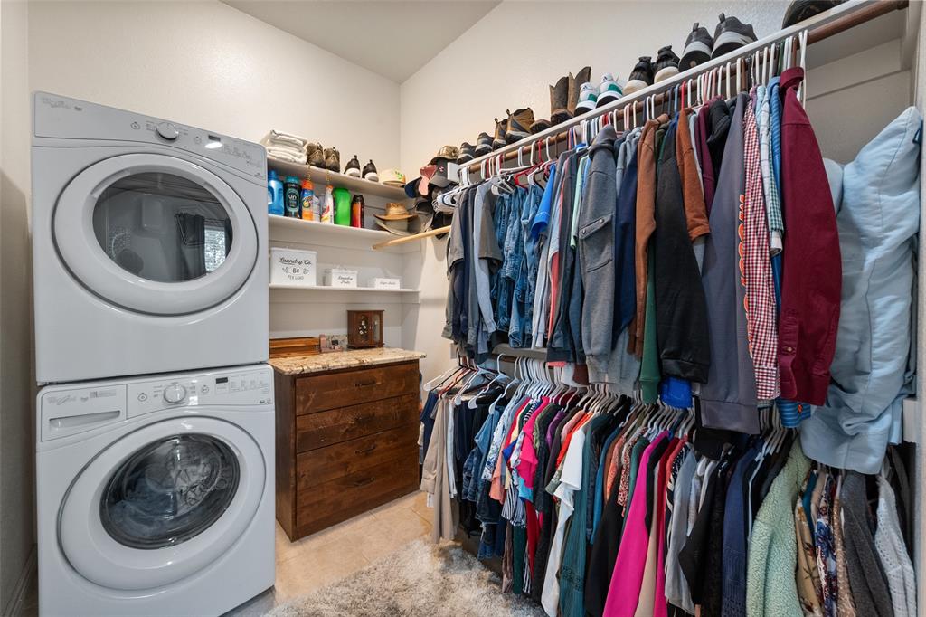 606 Sunset Point Kerens, TX 75144 - Photo 28 of 39 a view of walk in closet with clothes and shoes