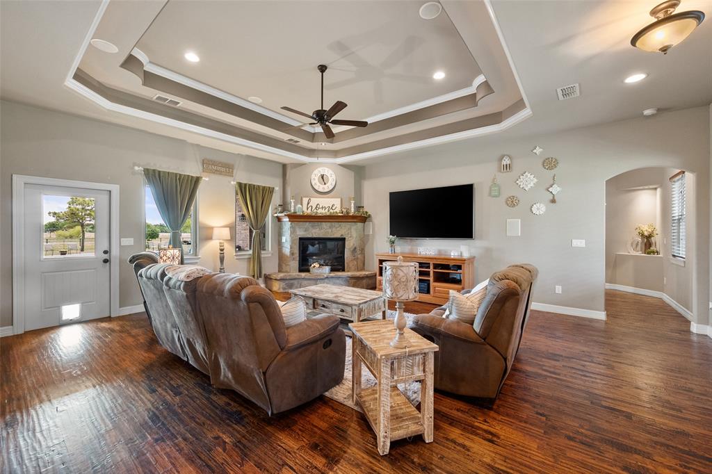 606 Sunset Point Kerens, TX 75144 - Photo 5 of 39 a living room with furniture fireplace and flat screen tv
