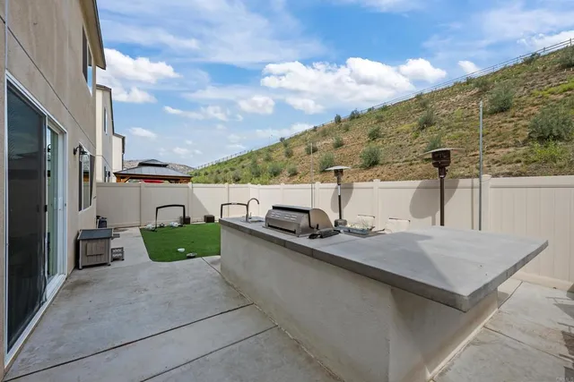 a terrace with outdoor seating and city view