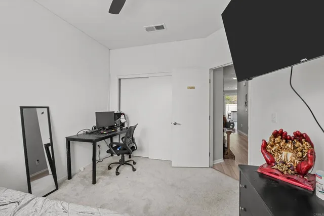 a view of a hallway with workspace