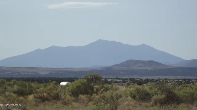 a view of mountain and sunset