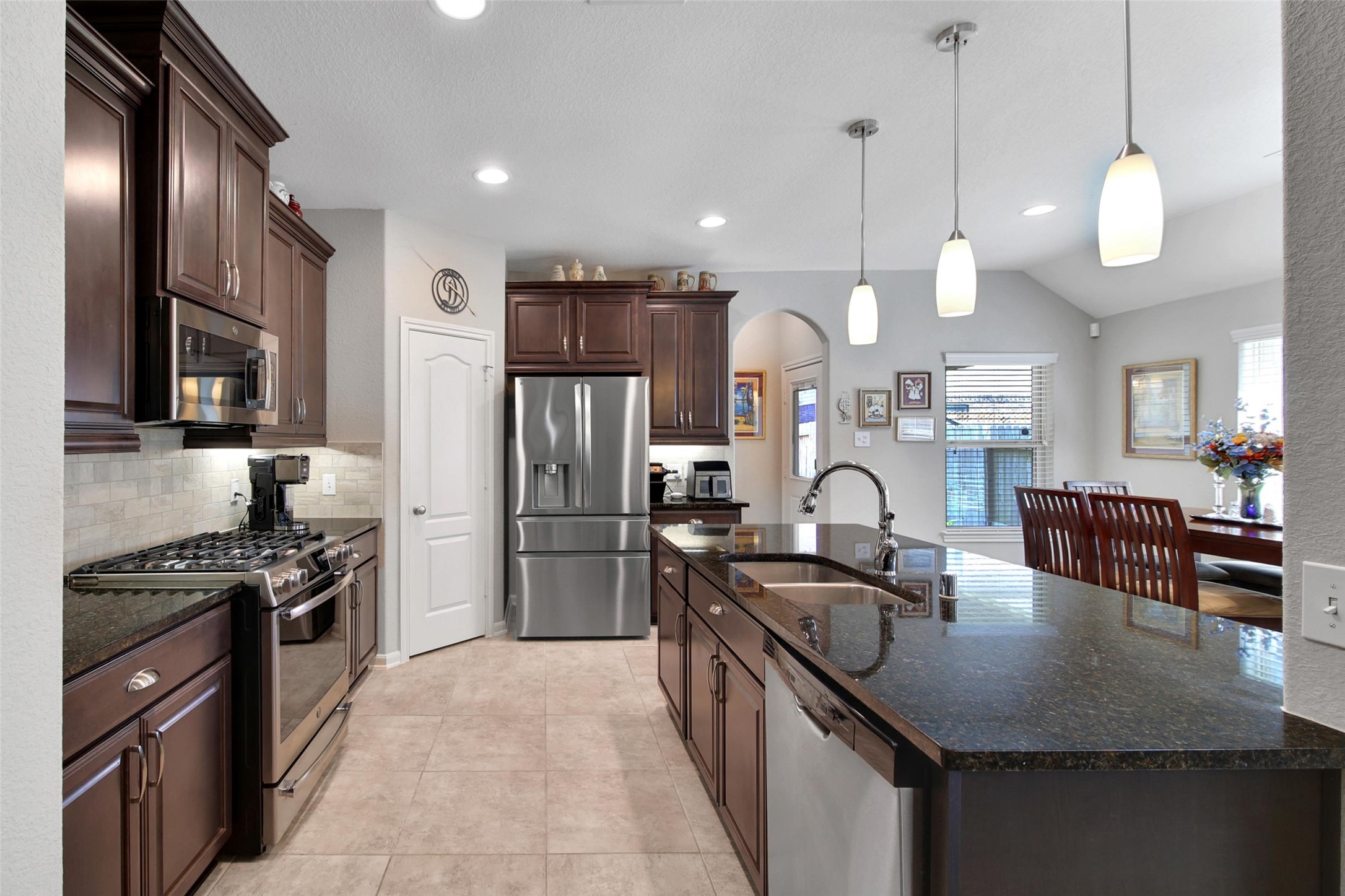 214 Pleasant Hill Way Conroe, TX 77304 - Photo 15 of 43 Plenty of counter space and under cabinet lighting makes your prep work more enjoyable.