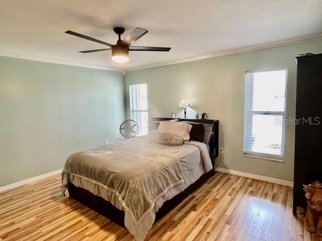 7971 Waupegan Avenue Sebastian, FL 32958 - Photo 13 of 26 a bedroom with a bed and window