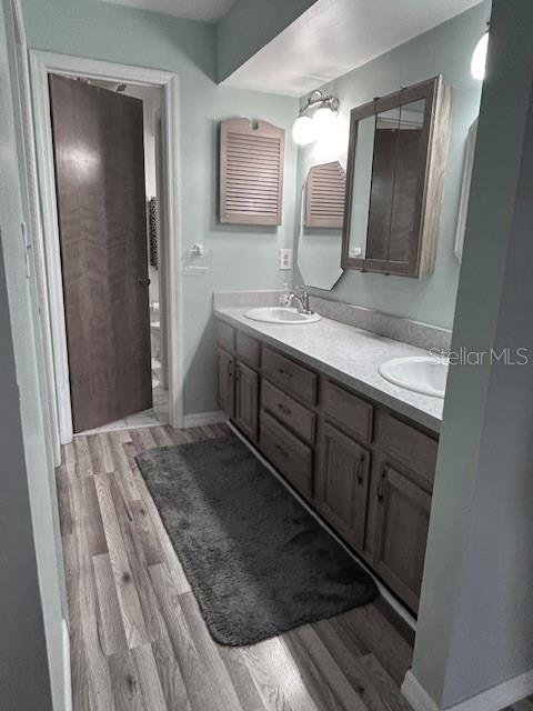 7971 Waupegan Avenue Sebastian, FL 32958 - Photo 14 of 26 a bathroom with a double vanity sink and mirror
