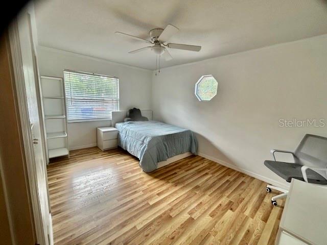 7971 Waupegan Avenue Sebastian, FL 32958 - Photo 16 of 26 a bedroom with a bed and window