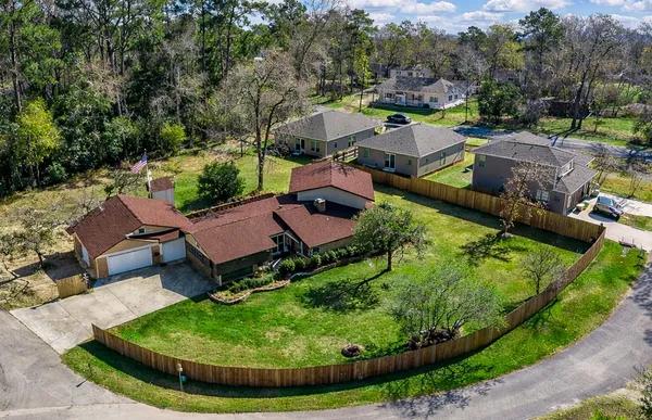 an aerial view of a house with garden