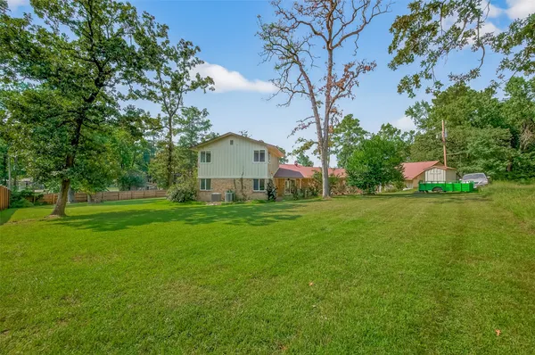 a view of a house with a big yard
