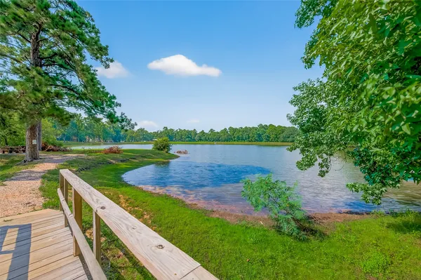 a view of a lake with a yard