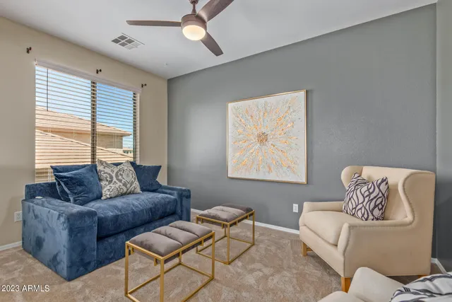 a living room with furniture and a large window