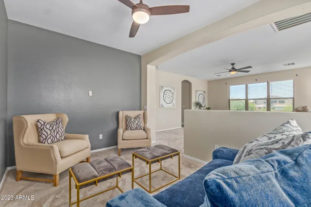 a living room with furniture and a window
