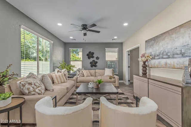 a living room with furniture and a large window