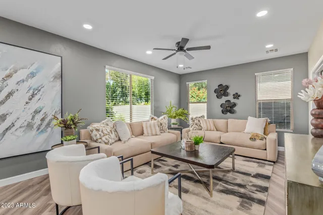 a living room with furniture and a large window