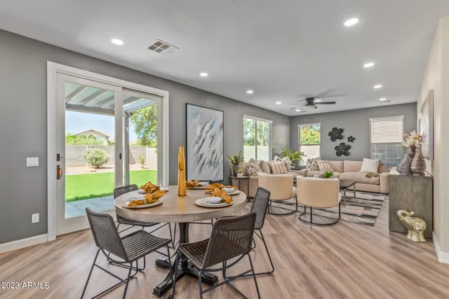 a view of a dining room with furniture window and outside view