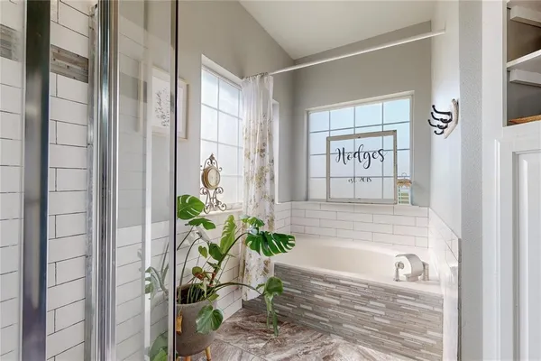 a bath tub sitting next to a window