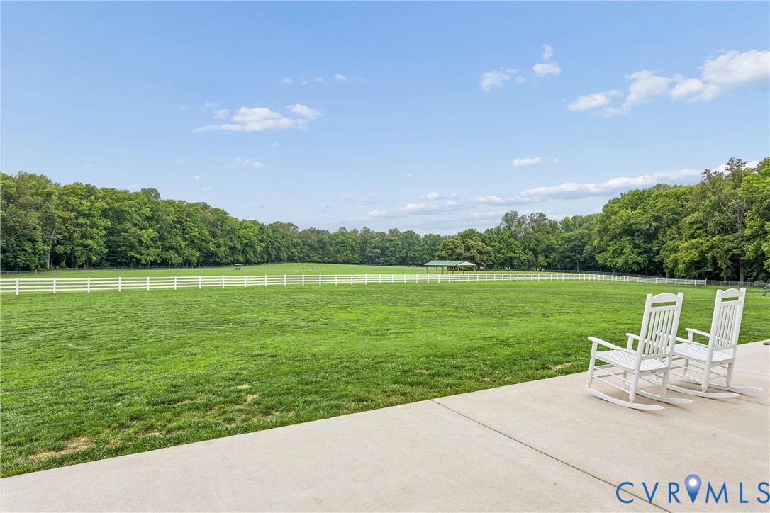 2016 Forge Road Toano, VA 23168 - Photo 83 of 99 Expansive green field encircled by a white fence a