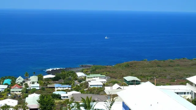 an aerial view of a city and mountain view in back