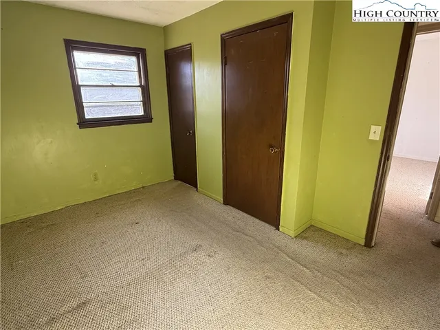 a bathroom with a sink toilet and mirror