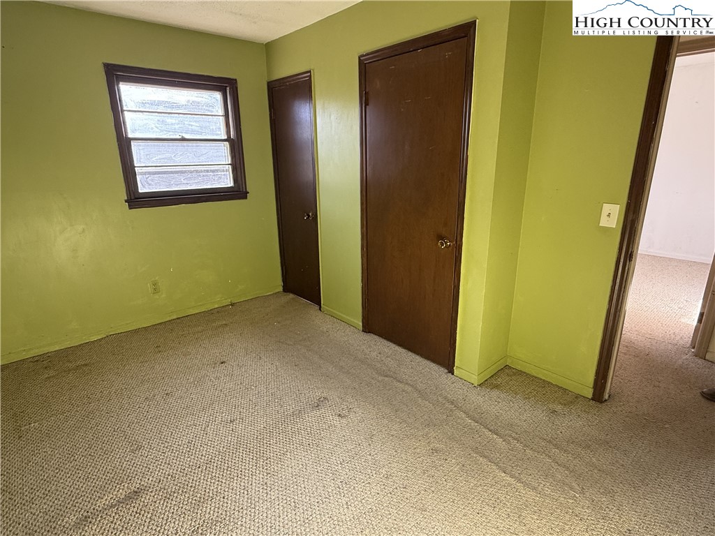 288 Sussex Road Grassy Creek, NC 28631 - Photo 15 of 22 an empty room with windows and closet