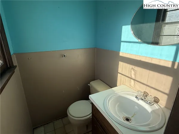 a view of water heater room with stairs