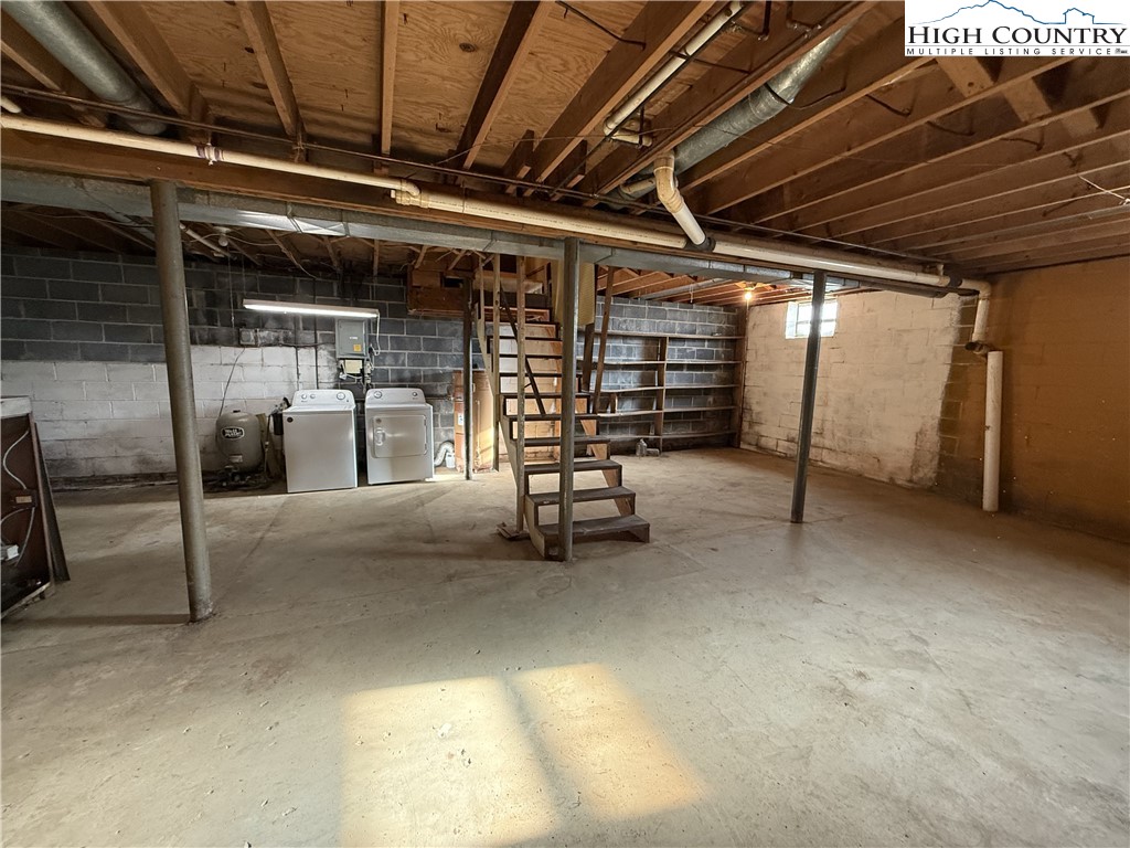 288 Sussex Road Grassy Creek, NC 28631 - Photo 17 of 22 a view of water heater room with stairs