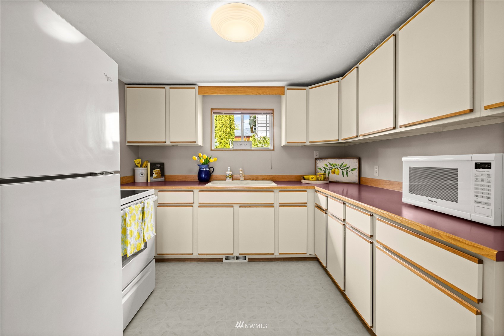 420 Southwest Sunset Boulevard Renton, WA 98057 - Photo 6 of 36 a kitchen with a sink cabinets and window
