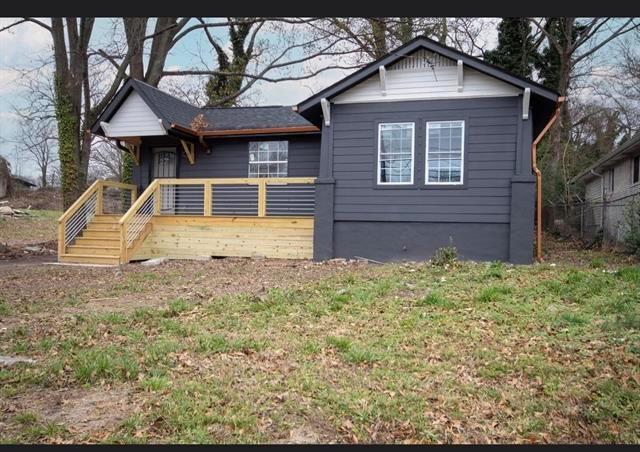 25 Mildred Place Northwest Atlanta, GA 30318 - Photo 1 of 1 a front view of a house with garden