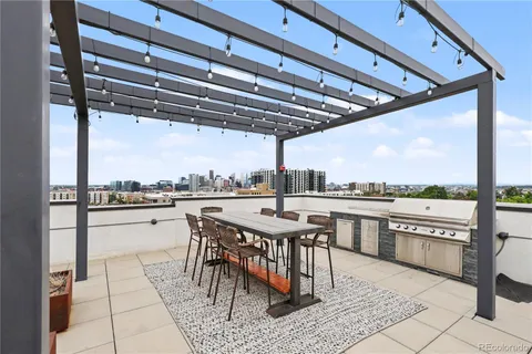 a view of a patio with a table chairs and a table