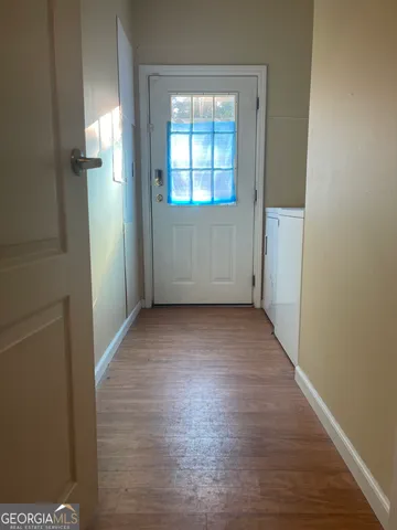 a white toilet sitting next to a shower curtain