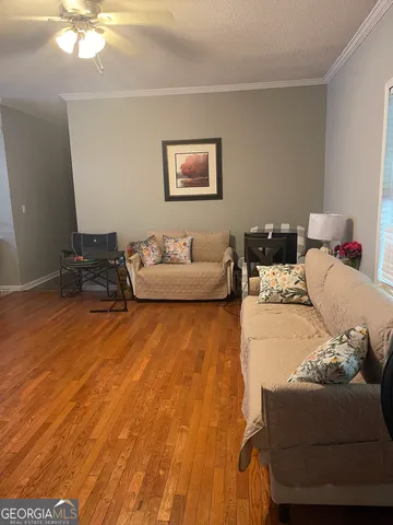 a view of a dining room with furniture and a window
