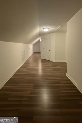 a view of room and hardwood floor