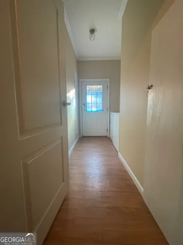 a kitchen with granite countertop a refrigerator and a stove top oven