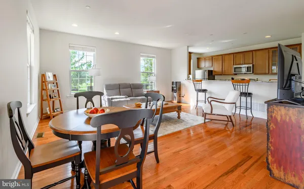 a view of a dining room with furniture and wooden floor
