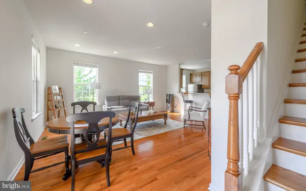 a view of a dining room with furniture window and wooden floor