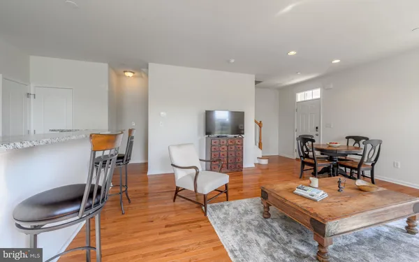 a living room with furniture and a rug