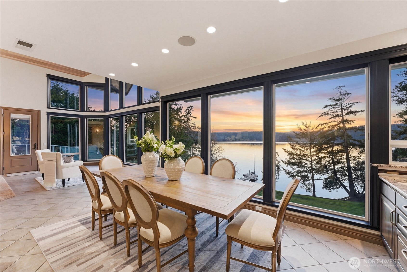 2155 Deer Harbor Road Orcas Island, WA 98243 - Photo 6 of 40 a view of a dining room with furniture large windows and wooden floor