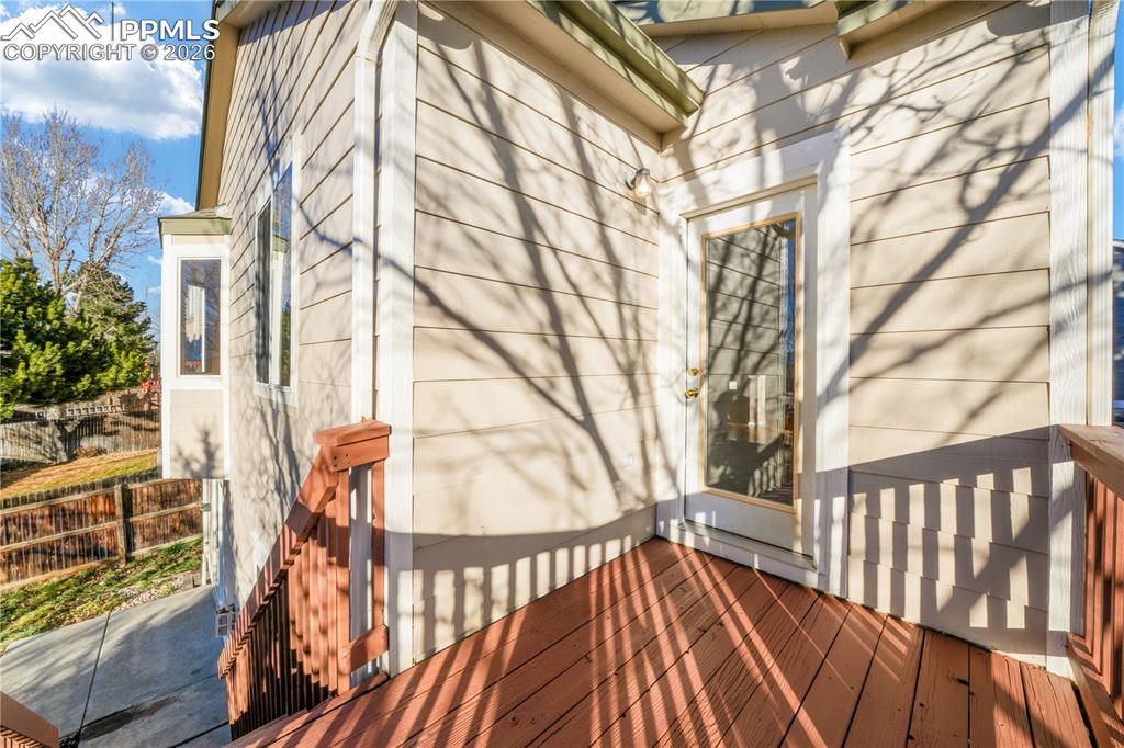 7170 Leeside View Colorado Springs, CO 80922 - Photo 14 of 50 a view of outdoor space with deck and wooden floor