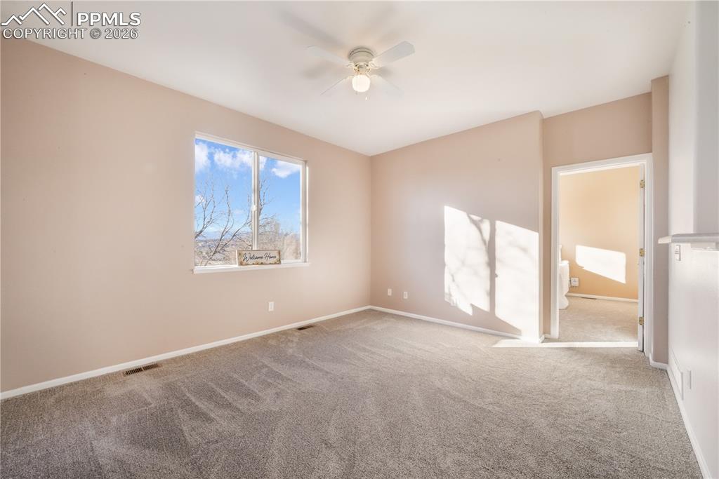 7170 Leeside View Colorado Springs, CO 80922 - Photo 20 of 50 a view of an empty room with a window