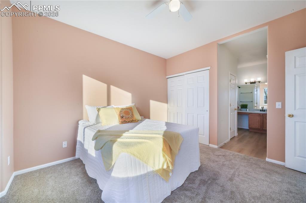 7170 Leeside View Colorado Springs, CO 80922 - Photo 22 of 50 a room with a bed and a view of bathroom