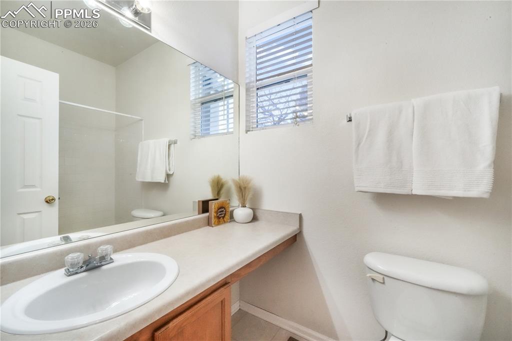 7170 Leeside View Colorado Springs, CO 80922 - Photo 29 of 50 a bathroom with a sink and a toilet