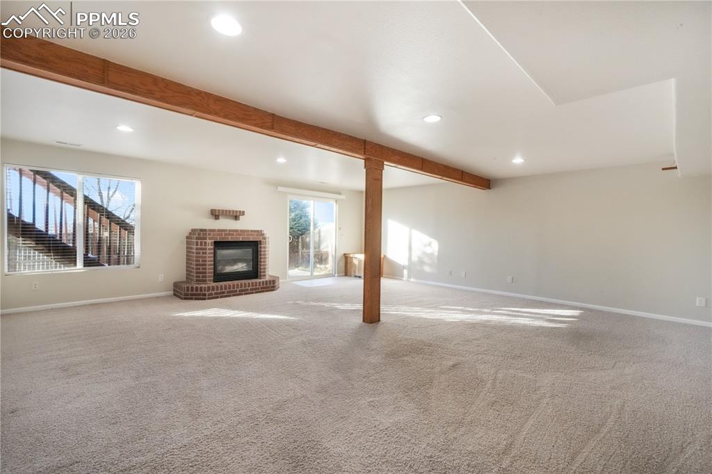 7170 Leeside View Colorado Springs, CO 80922 - Photo 30 of 50 a view of an empty room with a fireplace