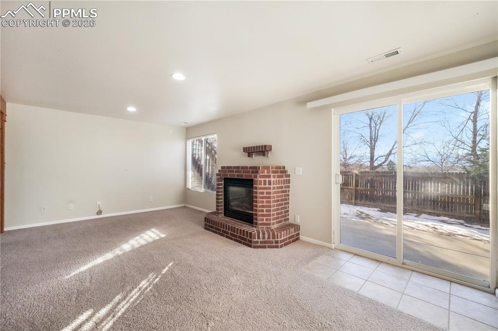 7170 Leeside View Colorado Springs, CO 80922 - Photo 32 of 50 a view of a hallway with fireplace