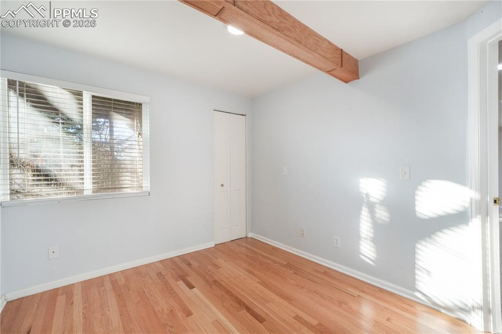 7170 Leeside View Colorado Springs, CO 80922 - Photo 36 of 50 a view of empty room with wooden floor