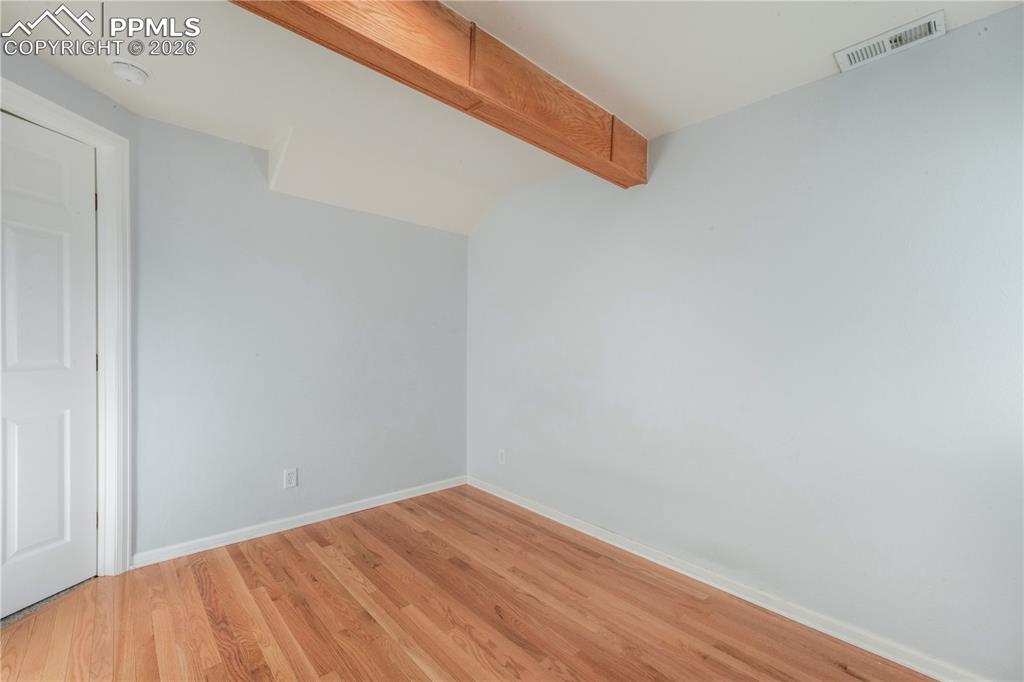 7170 Leeside View Colorado Springs, CO 80922 - Photo 38 of 50 a view of empty room with wooden floor