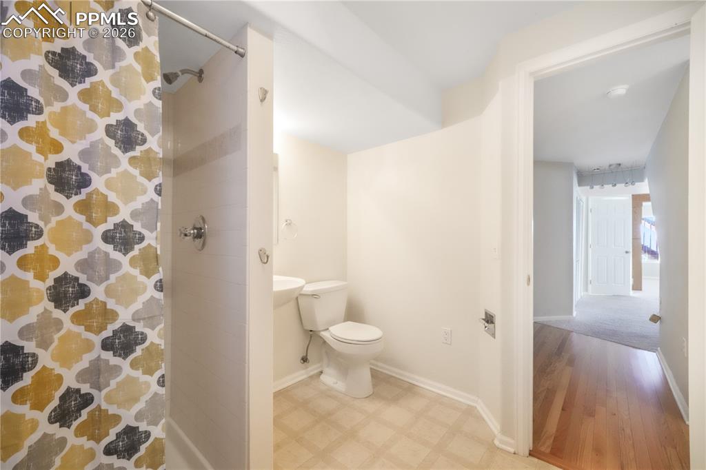7170 Leeside View Colorado Springs, CO 80922 - Photo 40 of 50 a bathroom with a toilet and a shower
