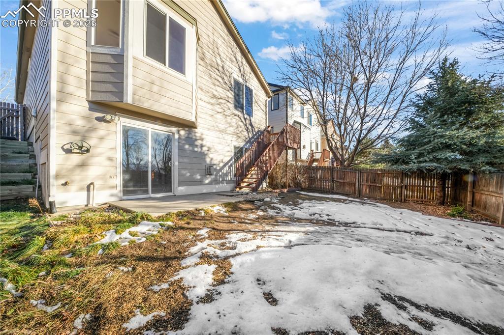 7170 Leeside View Colorado Springs, CO 80922 - Photo 43 of 50 a view of a house with snow on the road