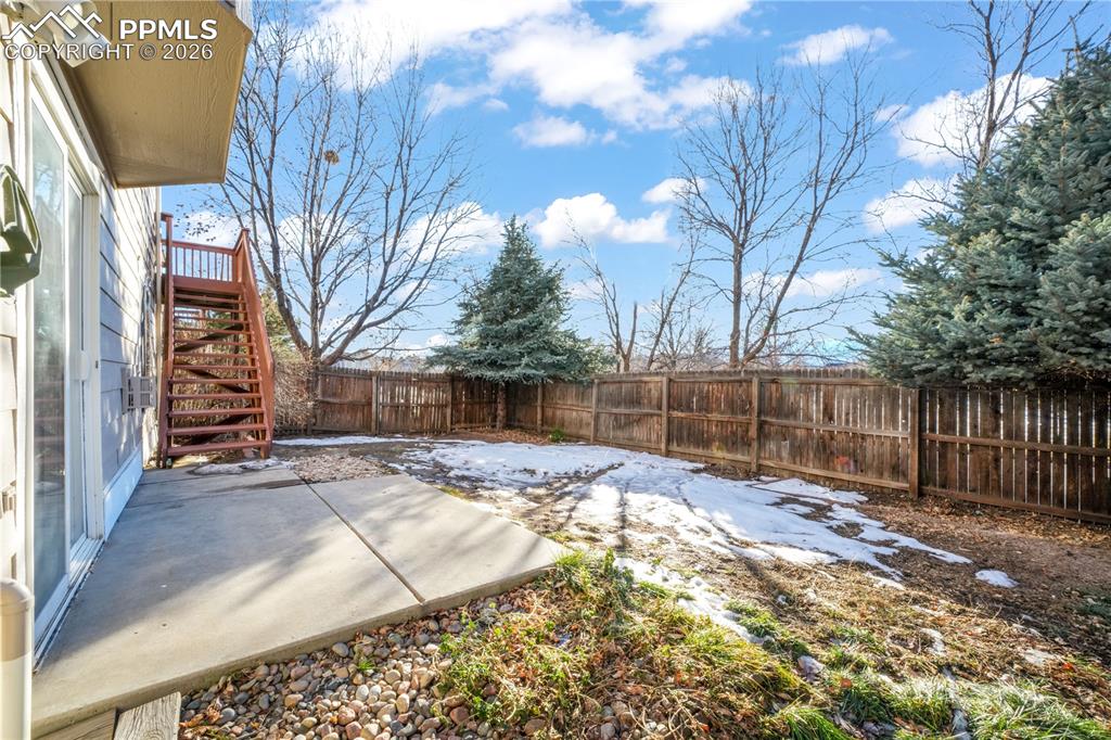 7170 Leeside View Colorado Springs, CO 80922 - Photo 44 of 50 a view of a backyard with wooden fence